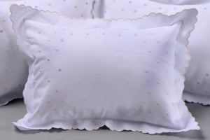 Our embroidered “Dotted Swiss” pillows are made on 200-count cotton. They are perfect for monograms and personalization. Handmade dots surround a blank area in the middle of the pillow to accommodate a beautiful embroidered monogram or name. The sham is removable for machine washing and features our split back opening. This is a 12x16 conventional size baby/boudoir sham. Pillow inserts are available.