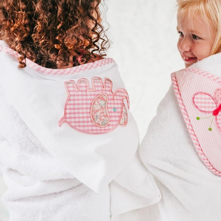 Our everykid towels are ideal for older children and also make a wonderful "grow into" baby gift. They feature a terry lined hood, which is sewn to a long side of the towel and is embellished with one of our signature appliques. Perfect for bath, beach or pool time; each towel comes ready for gift giving - rolled and tied with a beautiful grosgrain ribbon.